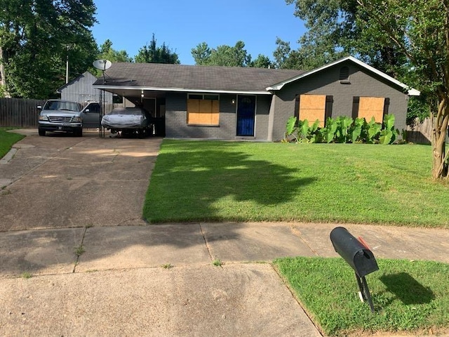 ranch-style house featuring concrete driveway, brick siding, an attached carport, and heating fuel