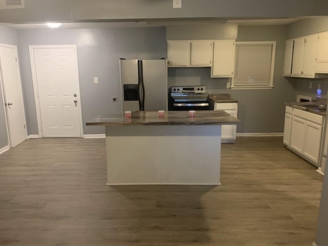 kitchen featuring stainless steel appliances, white cabinetry, baseboards, and dark wood-type flooring