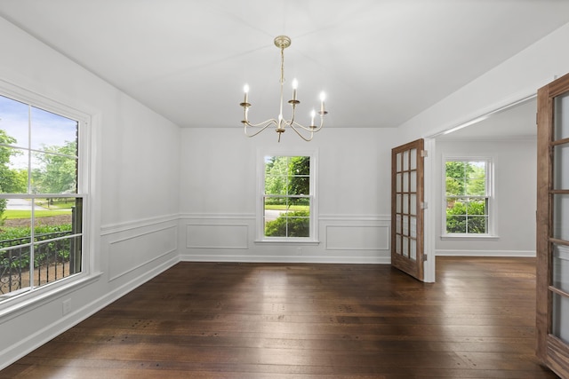 5516 Sycamore Grove Ln, Memphis, TN 38120 - unfurnished room featuring a chandelier, dark wood-type flooring, and wainscoting