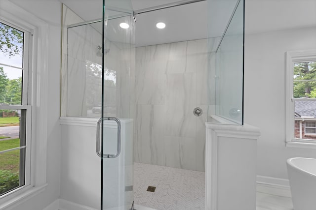 5516 Sycamore Grove Ln, Memphis, TN 38120 - full bathroom with a stall shower, a freestanding bath, baseboards, and recessed lighting