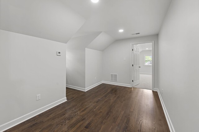 5516 Sycamore Grove Ln, Memphis, TN 38120 - additional living space with lofted ceiling, dark wood-type flooring, baseboards, and recessed lighting
