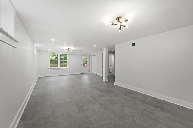 5516 Sycamore Grove Ln, Memphis, TN 38120 - spare room featuring baseboards, recessed lighting, and a chandelier