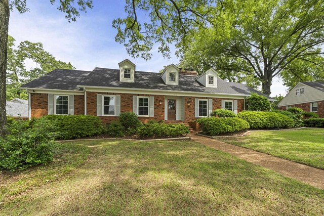 5516 Sycamore Grove Ln, Memphis, TN 38120 - new england style home featuring brick siding and a front yard