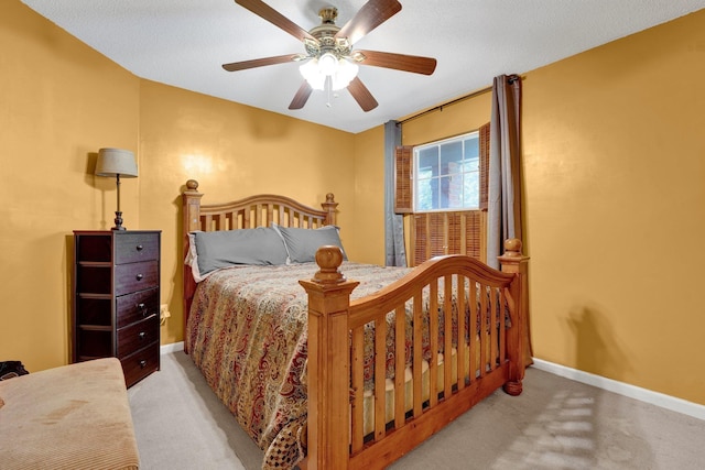 bedroom featuring carpet flooring, baseboards, and ceiling fan