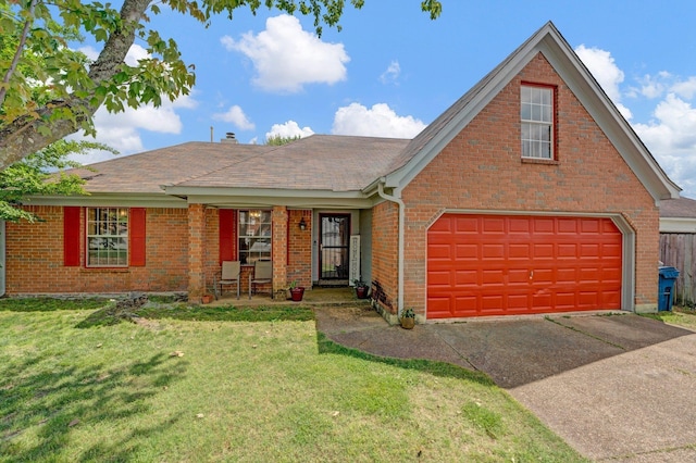 view of front of house with a front yard, concrete driveway, brick siding, and roof with shingles