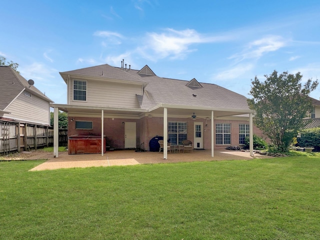 back of house with a hot tub, a patio, and ceiling fan
