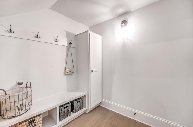 mudroom with light wood-style floors and baseboards