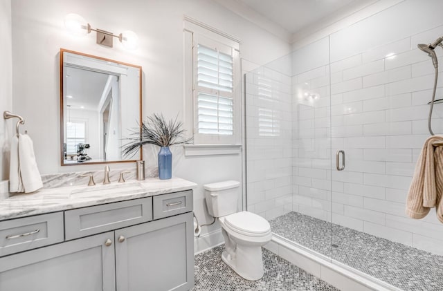 full bathroom with a shower stall, toilet, vanity, and tile patterned flooring