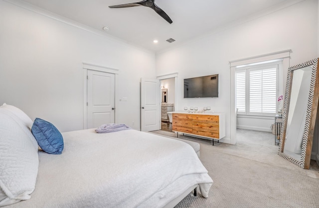 bedroom with ornamental molding, baseboards, light colored carpet, a ceiling fan, and connected bathroom