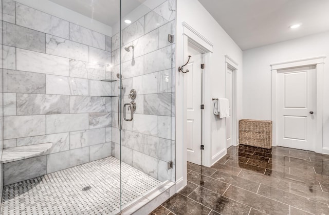 full bathroom featuring a stall shower, recessed lighting, and baseboards