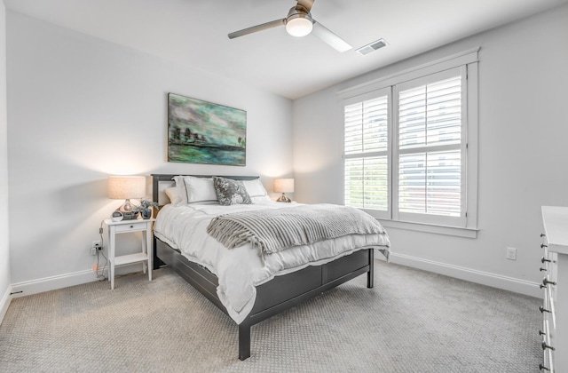carpeted bedroom with baseboards and a ceiling fan