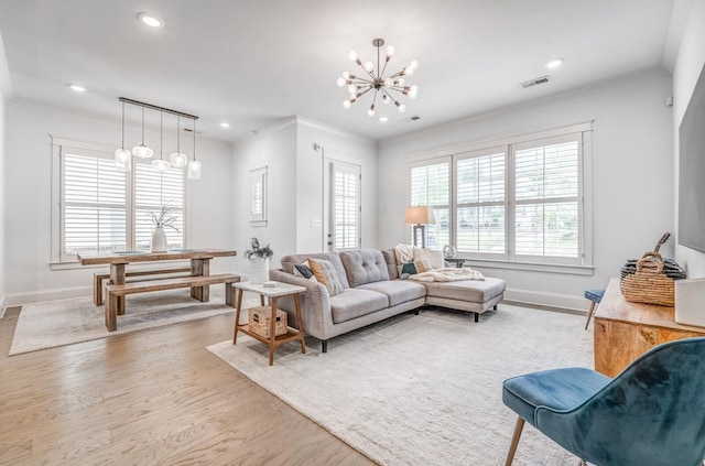 living room with a chandelier, wood finished floors, baseboards, recessed lighting, and crown molding