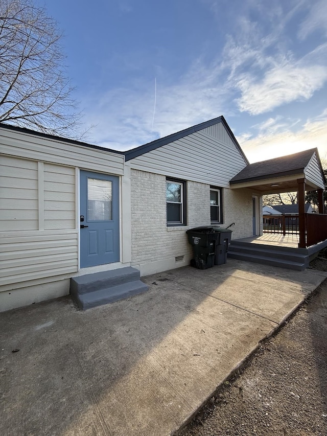 1340 S Perkins Rd, Memphis, TN 38117 - rear view of house with crawl space, brick siding, and a wooden deck