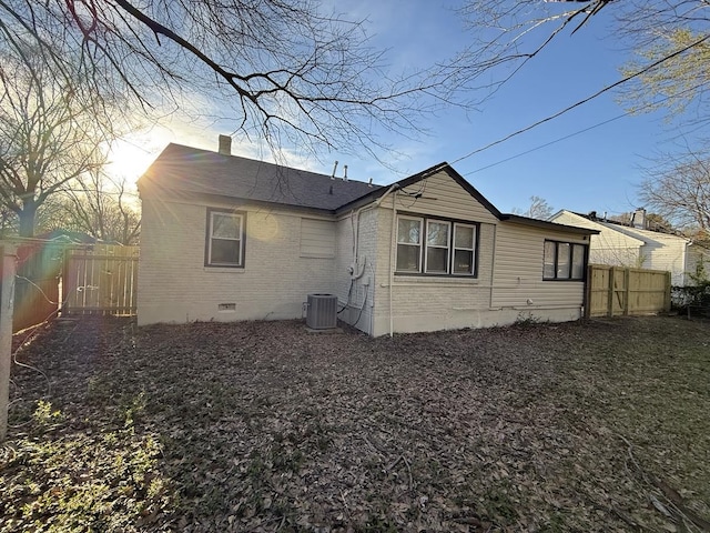 1340 S Perkins Rd, Memphis, TN 38117 - rear view of house featuring brick siding, crawl space, fence, and a chimney