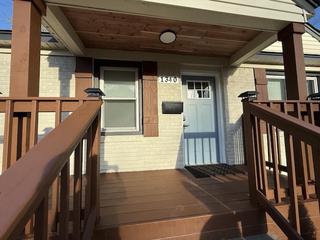 1340 S Perkins Rd, Memphis, TN 38117 - entrance to property featuring brick siding and a wooden deck