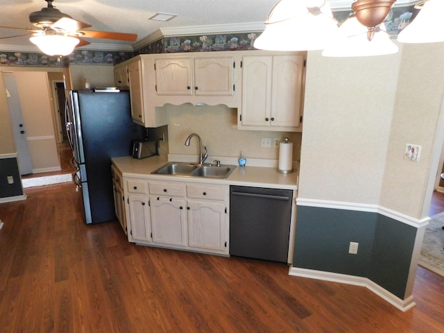 kitchen with stainless steel appliances, a sink, light countertops, a ceiling fan, and crown molding