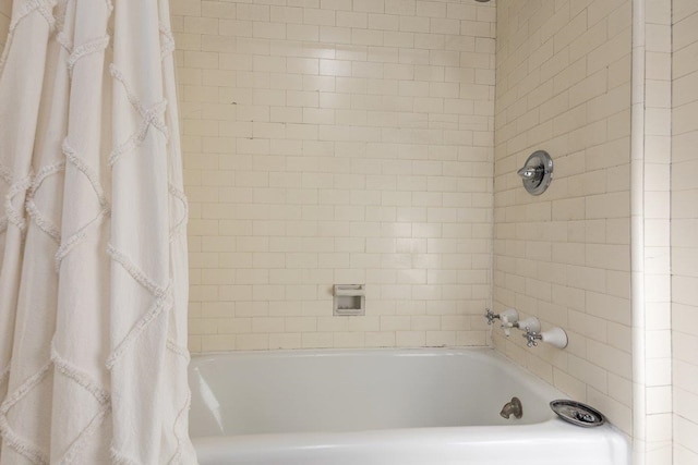 full bathroom with shower / bath combo with shower curtain