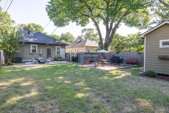 view of yard with a patio area and cooling unit