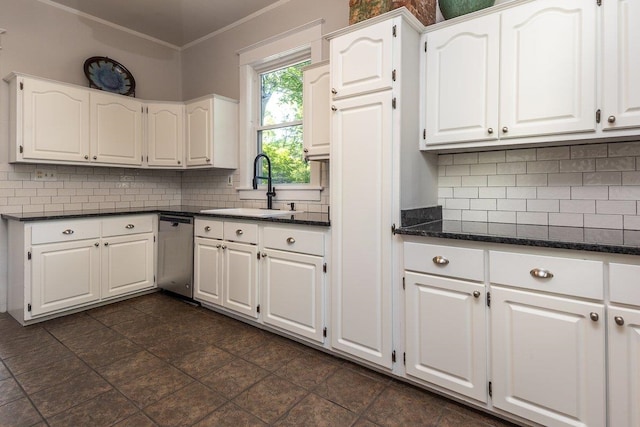 kitchen with dishwasher, a sink, ornamental molding, white cabinets, and decorative backsplash