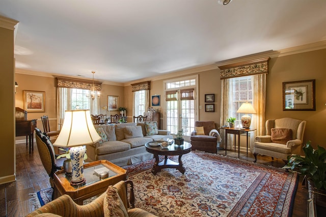 living room with a chandelier, crown molding, baseboards, and dark wood-style floors