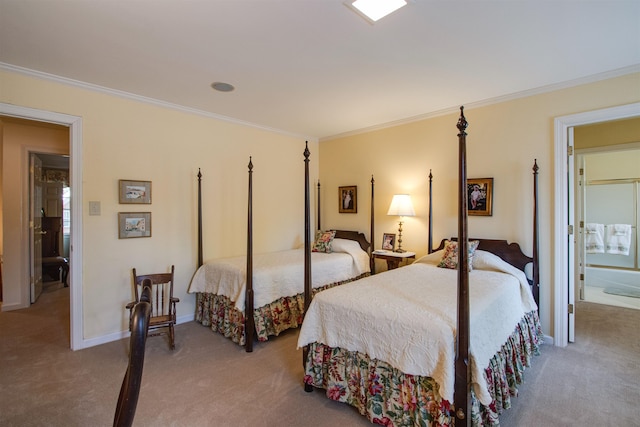 carpeted bedroom with ornamental molding and baseboards