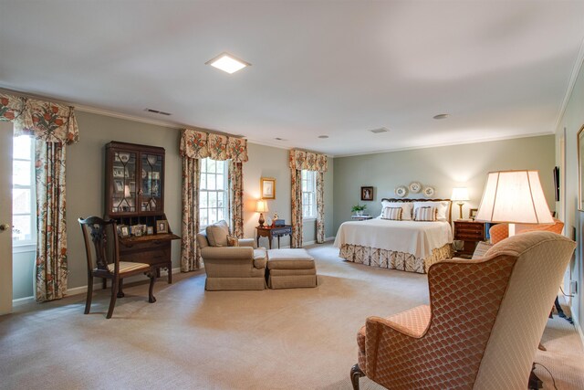 bedroom featuring light carpet, crown molding, and baseboards