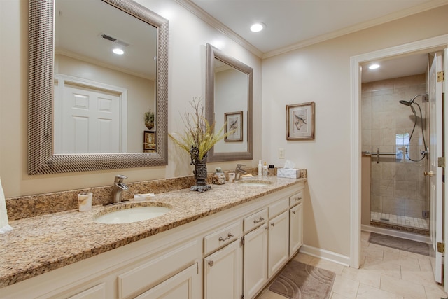 bathroom with a shower stall, baseboards, crown molding, double vanity, and recessed lighting