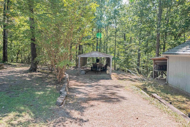 150 Island View Dr, Counce, TN 38326 - view of yard featuring a gazebo, dirt driveway, and a detached carport