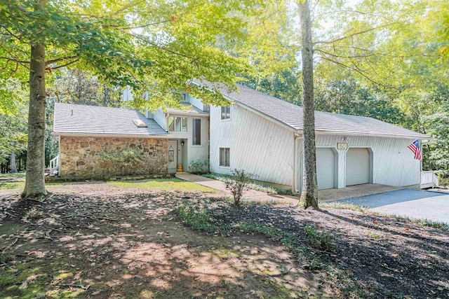 150 Island View Dr, Counce, TN 38326 - view of side of home with an attached garage and concrete driveway