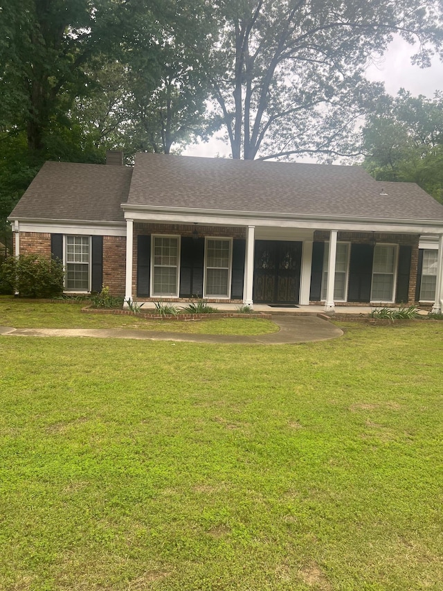 6233 Quince Rd, Memphis, TN 38119 - view of front of home with a front yard, roof with shingles, and brick siding