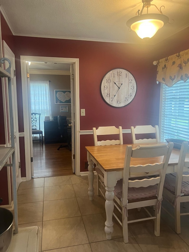 6233 Quince Rd, Memphis, TN 38119 - dining area featuring crown molding, light tile patterned floors, and a desk