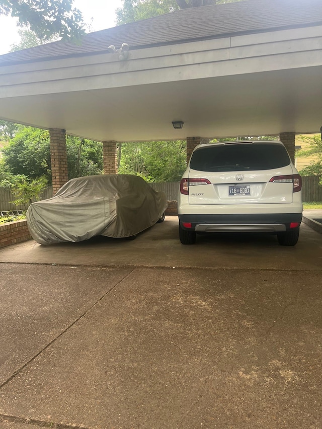 6233 Quince Rd, Memphis, TN 38119 - view of parking / parking lot featuring a carport