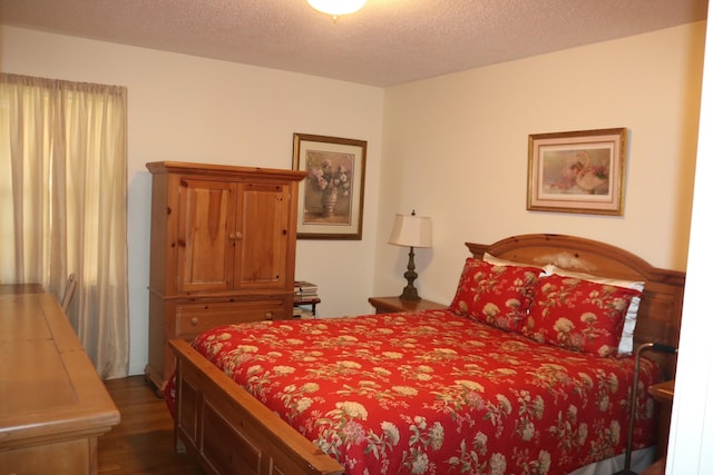 6233 Quince Rd, Memphis, TN 38119 - bedroom featuring dark wood-style floors and a textured ceiling