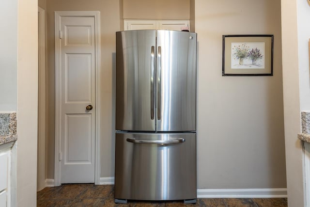 6932 Midhurst Rd Unit 6932, Memphis, TN 38119 - kitchen featuring freestanding refrigerator and white cabinets