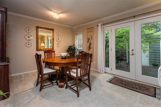 6932 Midhurst Rd Unit 6932, Memphis, TN 38119 - dining area with healthy amount of natural light, french doors, light colored carpet, crown molding, and a textured ceiling