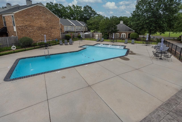 6932 Midhurst Rd Unit 6932, Memphis, TN 38119 - community pool featuring a patio area and an outbuilding