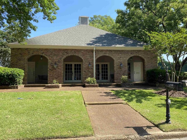 6932 Midhurst Rd Unit 6932, Memphis, TN 38119 - view of front of property featuring french doors, a front lawn, roof with shingles, brick siding, and a chimney