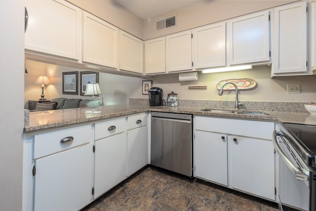 6932 Midhurst Rd Unit 6932, Memphis, TN 38119 - kitchen featuring appliances with stainless steel finishes, white cabinets, and light stone counters