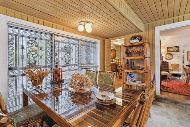 4948 Roane Rd, Memphis, TN 38117 - carpeted dining space with wood ceiling and wood walls