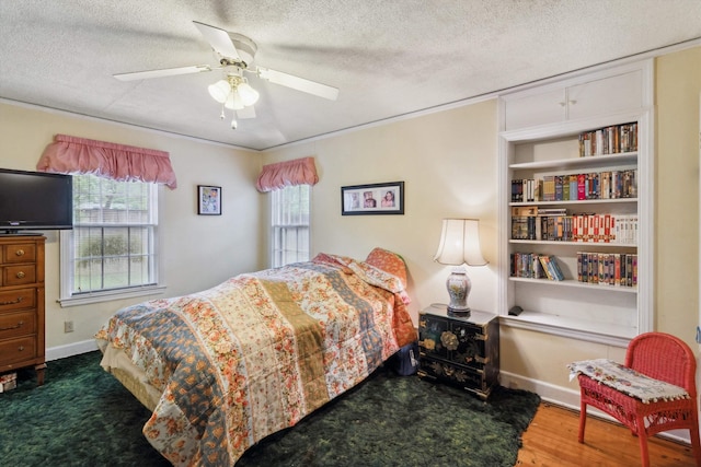 4948 Roane Rd, Memphis, TN 38117 - bedroom with a textured ceiling, a ceiling fan, wood finished floors, and baseboards