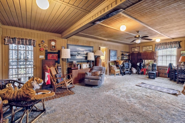 4948 Roane Rd, Memphis, TN 38117 - carpeted living area featuring wooden ceiling, a ceiling fan, wooden walls, and beam ceiling