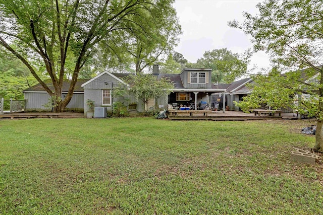 4948 Roane Rd, Memphis, TN 38117 - rear view of property with a chimney, central AC, a lawn, and a deck