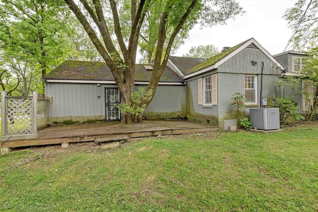 4948 Roane Rd, Memphis, TN 38117 - back of property featuring cooling unit, brick siding, a lawn, and a wooden deck