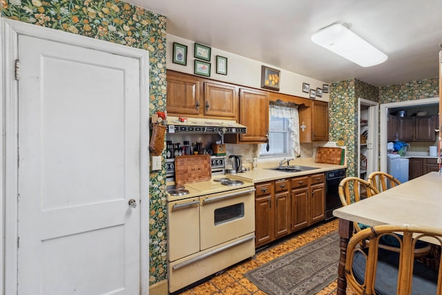 4948 Roane Rd, Memphis, TN 38117 - kitchen featuring range with two ovens, dishwasher, independent washer and dryer, a sink, and wallpapered walls