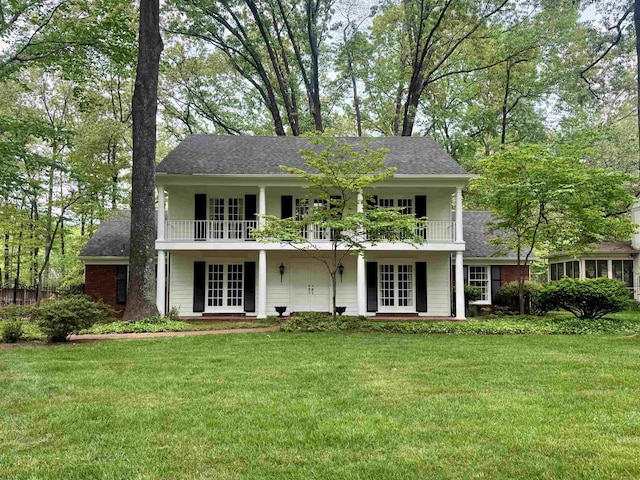 6378 Kirby Oaks Dr, Memphis, TN 38119 - view of front of home featuring french doors, a balcony, a front lawn, and a shingled roof