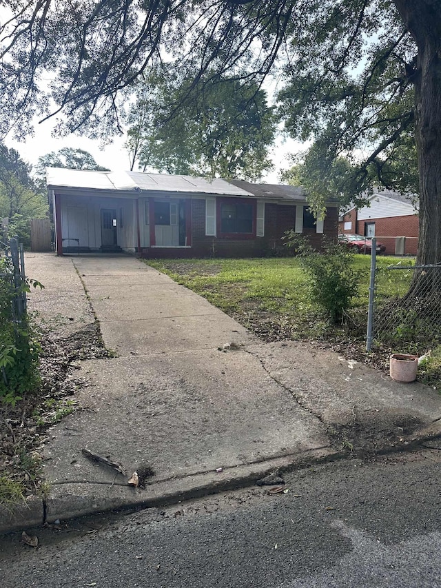 4016 Leech Rd, Memphis, TN 38109 - ranch-style home with driveway and an attached carport