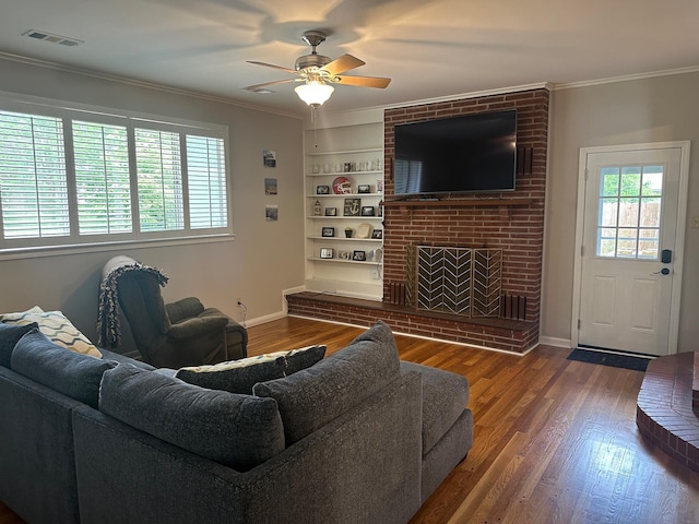 151 N White Station Rd, Memphis, TN 38117 - living room featuring wood finished floors, ceiling fan, ornamental molding, a fireplace, and baseboards