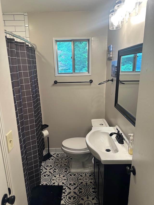 151 N White Station Rd, Memphis, TN 38117 - bathroom featuring healthy amount of natural light, a shower with curtain, toilet, and vanity