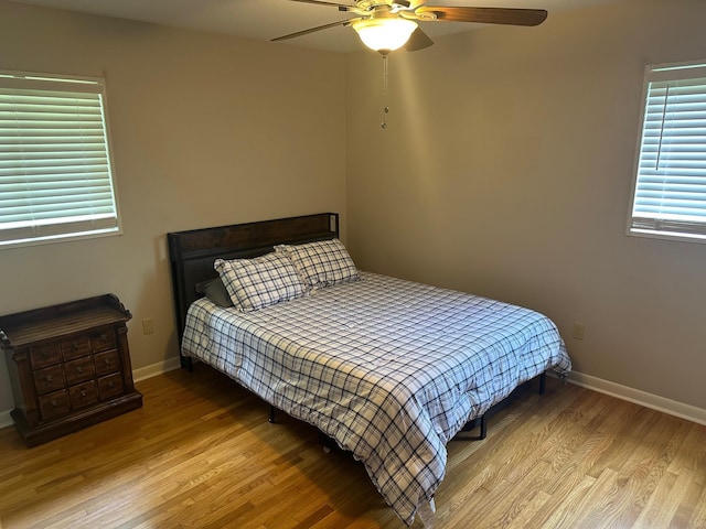 151 N White Station Rd, Memphis, TN 38117 - bedroom with wood finished floors, baseboards, and ceiling fan