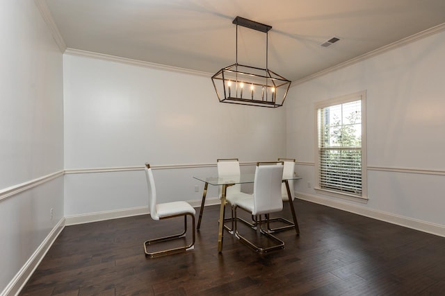 dining area with crown molding, dark wood-style flooring, baseboards, and a chandelier